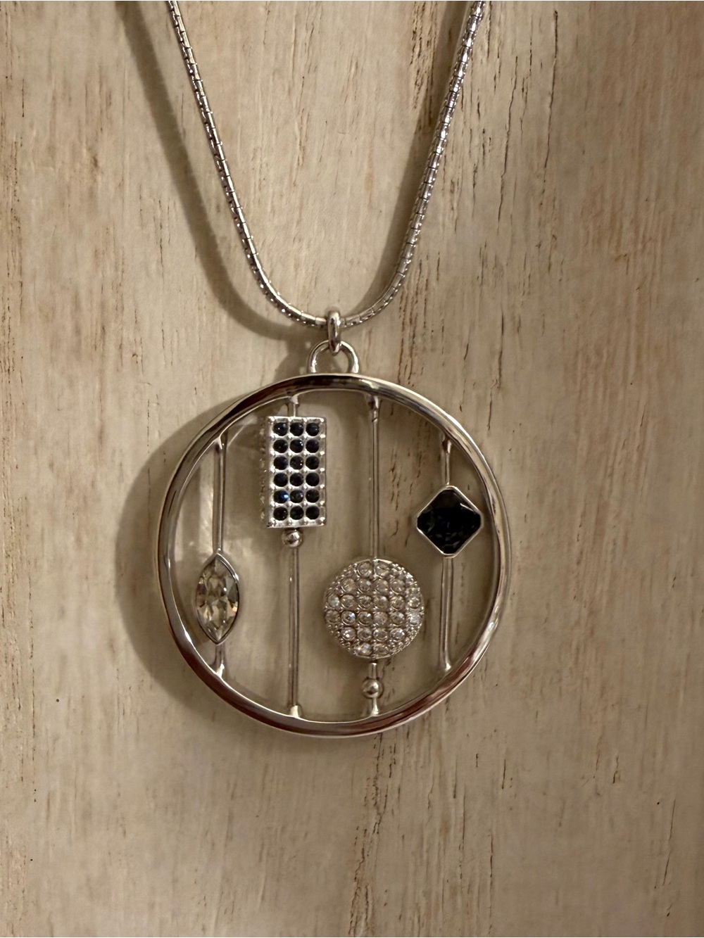 Touchstone Crystal Circle Pendant Necklace with Black and Clear Accents
